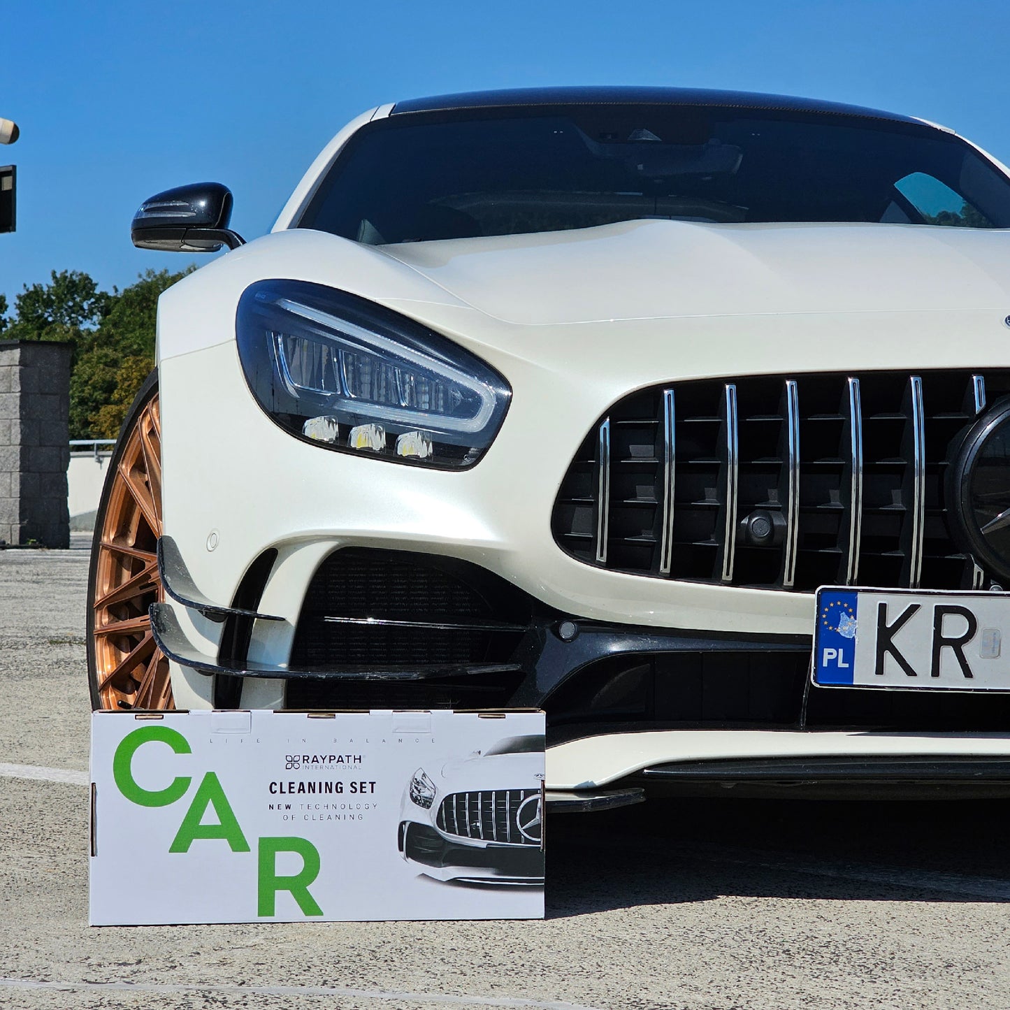 Box with car parked next to it